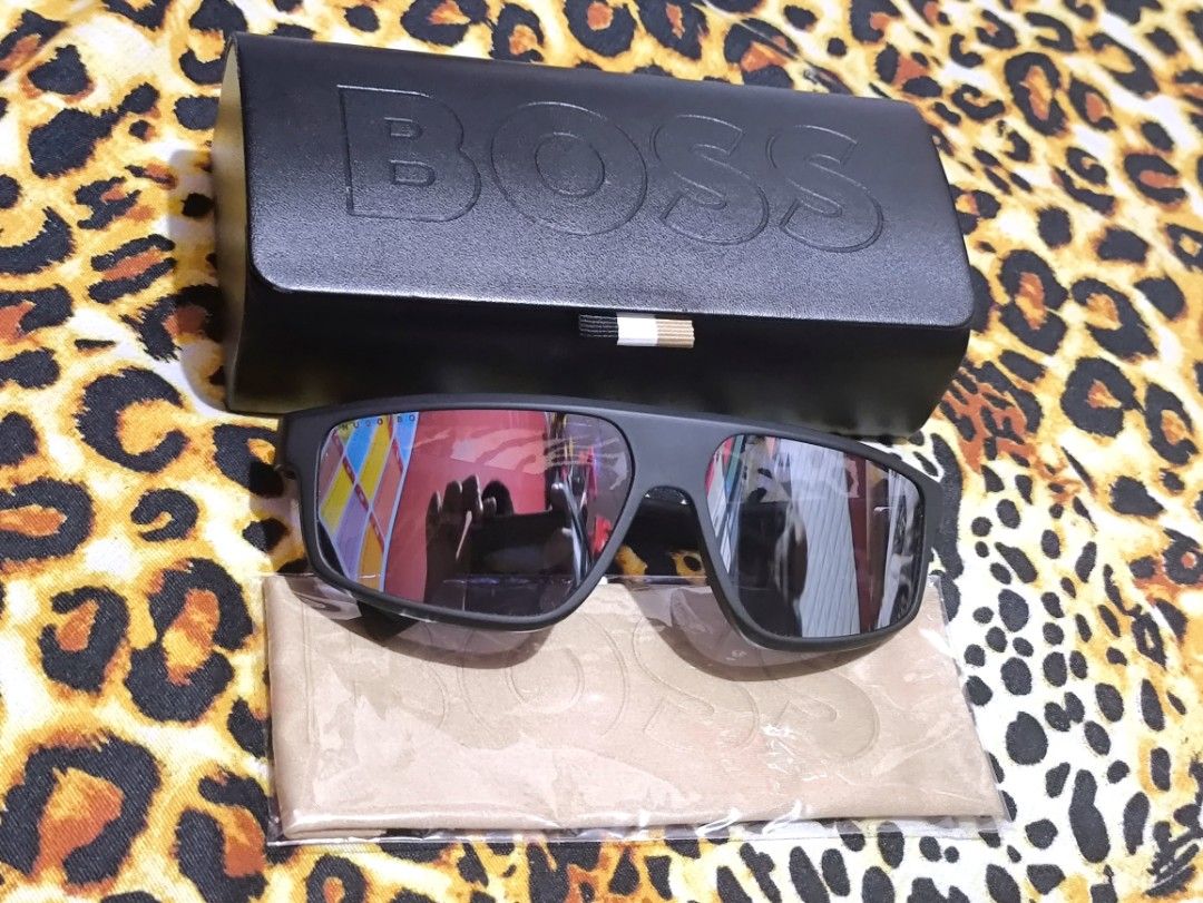 Hugo Boss Sunglasses with Case and Cloth (Category: Sunglasses & Eyewear) located in Manila. Submitted by joshramly (Listing ID 1448815080, Image 1). Description: - Authentic Hugo Boss sunglasses - Sleek black frame - Stylish mirrored lenses - Expertly crafted in Italy - Comes with original BOSS case - Includes original cleaning cloth - Ideal for sunny weather and outdoor activities.