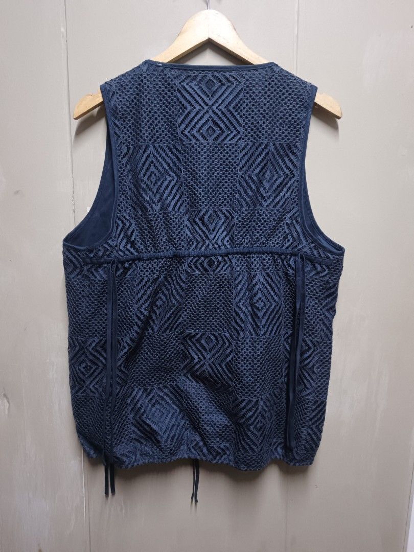 INITIAL Navy Blue Textured Wrap Vest (Category: Vests) located in Dasmarinas. Submitted by jessicamae43174 (Listing ID 1448824465, Image 2). Description: - Brand: INITIAL - Width 20.5 Length 27 - Color: Navy Blue - Design: Textured geometric pattern all over - Style: Wrap front with drawstring tie at waist, sleeveless - Material: 55% Cotton, 45% Nylon - Perfect for layering.