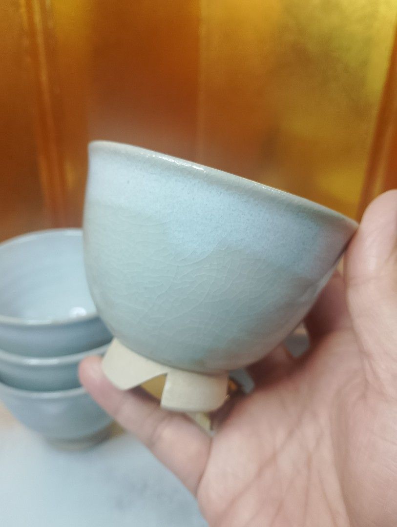 Japanese Style Stoneware Teapot and Cups Set (Category: Coffee & Tea Tableware) located in Valenzuela. Submitted by buylaaaaa (Listing ID 1448709366, Image 2). Description: - Beautiful ceramic teapot and 4 matching cups - Light grey glaze with a subtle crackle finish - Comfortable handle and easy-pour spout on teapot - Cups are stackable for convenient storage - Perfect for a calming tea experience - A lovely addition to any kitchen or tea collec
