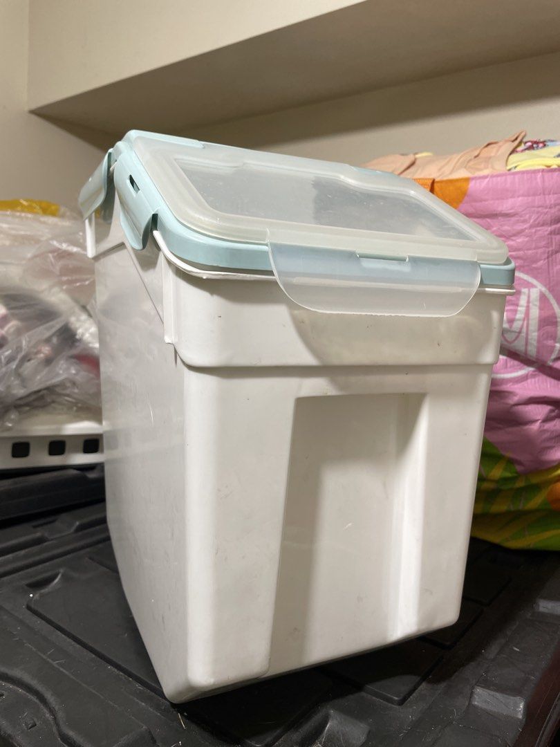 Large Capacity Airtight Pet Food Storage Container (Category: Food Organization & Storage) located in Quezon City. Submitted by romsr (Listing ID 1448747634, Image 1). Description: - Large capacity: Holds up to 25kg of dry pet food. - Freshness guaranteed: Airtight lid seals out moisture and keeps food fresh. - Easy to move: Built-in wheels for effortless transport. - Stylish design: Clean white and light blue color scheme..