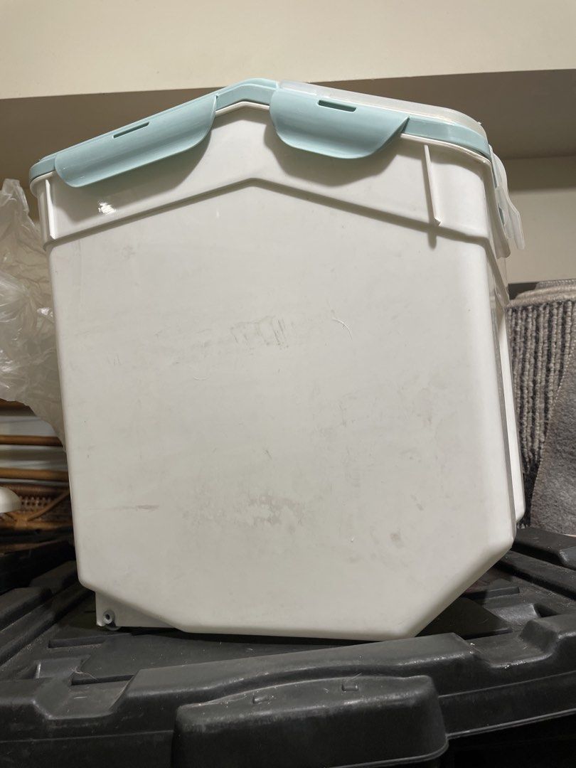 Large Capacity Airtight Pet Food Storage Container (Category: Food Organization & Storage) located in Quezon City. Submitted by romsr (Listing ID 1448747634, Image 2). Description: - Large capacity: Holds up to 25kg of dry pet food. - Freshness guaranteed: Airtight lid seals out moisture and keeps food fresh. - Easy to move: Built-in wheels for effortless transport. - Stylish design: Clean white and light blue color scheme..
