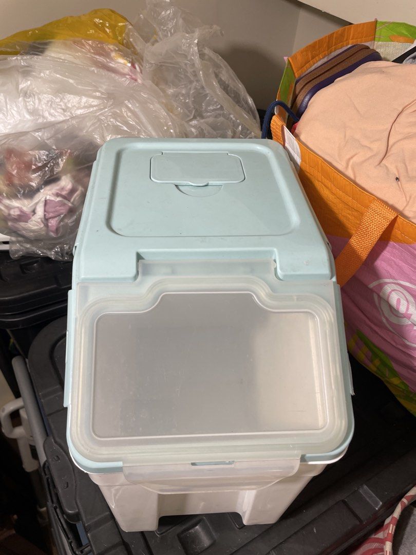 Large Capacity Airtight Pet Food Storage Container (Category: Food Organization & Storage) located in Quezon City. Submitted by romsr (Listing ID 1448747634, Image 3). Description: - Large capacity: Holds up to 25kg of dry pet food. - Freshness guaranteed: Airtight lid seals out moisture and keeps food fresh. - Easy to move: Built-in wheels for effortless transport. - Stylish design: Clean white and light blue color scheme..