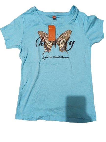 Light Blue Butterfly Graphic T-Shirt (Category: Shirts) located in Quezon City. Submitted by Think_Like_Chinita (Listing ID 1448787975, Image 1). Description: - Light blue t-shirt - Features a cool butterfly graphic on the front - Text reads 'Light As A Ballet Dancer' - Short sleeves and crew neck design - Ideal for casual everyday wear.