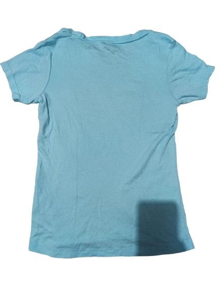 Light Blue Butterfly Graphic T-Shirt (Category: Shirts) located in Quezon City. Submitted by Think_Like_Chinita (Listing ID 1448787975, Image 2). Description: - Light blue t-shirt - Features a cool butterfly graphic on the front - Text reads 'Light As A Ballet Dancer' - Short sleeves and crew neck design - Ideal for casual everyday wear.