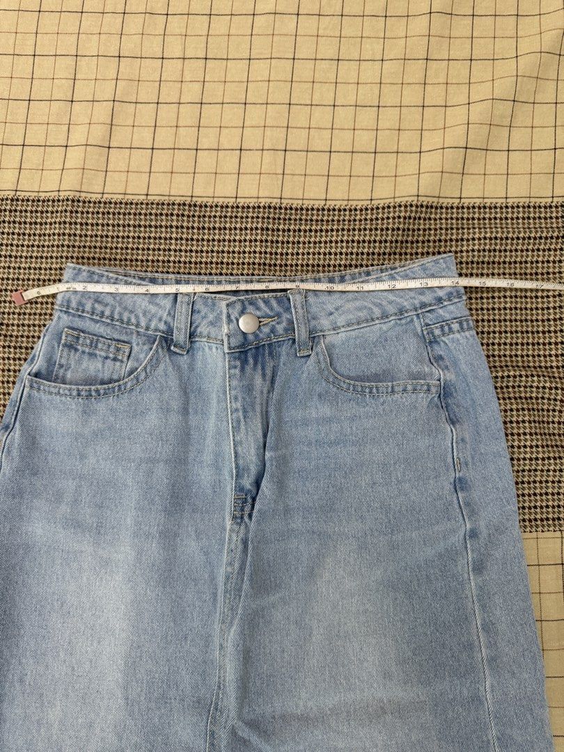 Light Wash Denim Maxi Skirt with Front Slit (Category: Skirts) located in Quezon City. Submitted by m3gan8 (Listing ID 1448741320, Image 2). Description: - Light wash denim maxi skirt - Features a front slit - Raw hem detail - Approximate size Medium - Waist: ~14 inches across - Length: ~35 inches - Ideal for casual wear.