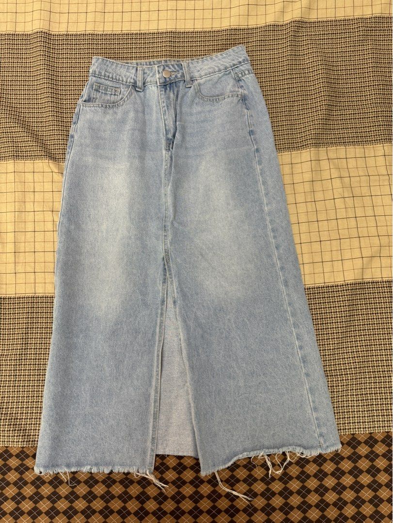Light Wash Denim Maxi Skirt with Front Slit (Category: Skirts) located in Quezon City. Submitted by m3gan8 (Listing ID 1448741320, Image 1). Description: - Light wash denim maxi skirt - Features a front slit - Raw hem detail - Approximate size Medium - Waist: ~14 inches across - Length: ~35 inches - Ideal for casual wear.