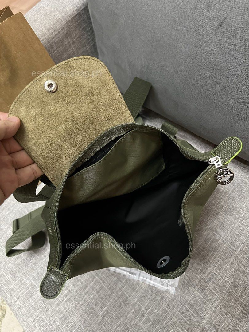 Longchamp Le Pliage Green M Backpack in Forrest (Category: Luxury Bags & Wallets) located in Manila. Submitted by essential.shop.ph (Listing ID 1448874911, Image 3). Description: FOR PRE-ORDER. 7-10 days ETA. Longchamp Le Pliage Green M Backpack Forrest Inclusions Paper bag and care card Dimensions 10.2 in (L - measured at the base of the bag) x 14.6 in (H) x 4.3 in (W).