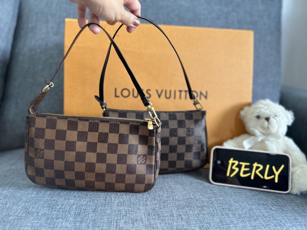 Louis Vuitton Damier Ebene Canvas Pochette Accessoires (Category: Luxury Bags & Wallets) located in Alicia. Submitted by berly06 (Listing ID 1448739099, Image 1). Description: - Authentic Louis Vuitton Damier Ebene pouch - Classic checkered canvas design - Includes a leather strap - Features elegant gold hardware - Ideal for carrying essentials or as a makeup bag - Versatile use as a clutch or internal bag organizer.