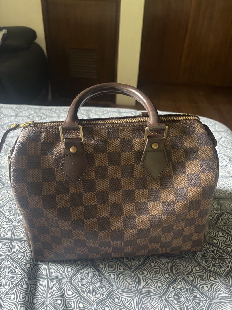 Louis Vuitton Speedy Damier Ebene Canvas Handbag (Category: Luxury Bags & Wallets) located in Quezon City. Submitted by engr36 (Listing ID 1448742789, Image 1). Description: - Authentic Louis Vuitton Speedy bag - Classic Damier Ebene canvas with iconic checkered pattern - Durable leather handles and trim - Elegant gold-tone hardware - Includes original lock - Spacious interior, ideal for everyday essentials.