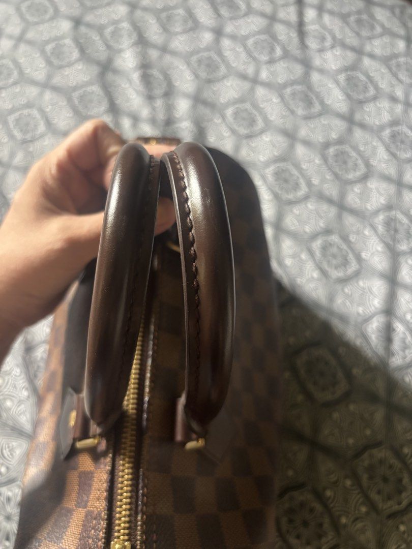Louis Vuitton Speedy Damier Ebene Canvas Handbag (Category: Luxury Bags & Wallets) located in Quezon City. Submitted by engr36 (Listing ID 1448742789, Image 3). Description: - Authentic Louis Vuitton Speedy bag - Classic Damier Ebene canvas with iconic checkered pattern - Durable leather handles and trim - Elegant gold-tone hardware - Includes original lock - Spacious interior, ideal for everyday essentials.