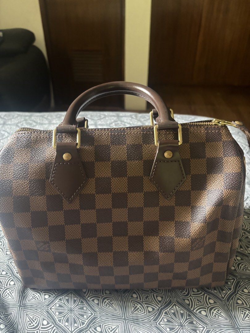 Louis Vuitton Speedy Damier Ebene Canvas Handbag (Category: Luxury Bags & Wallets) located in Quezon City. Submitted by engr36 (Listing ID 1448742789, Image 2). Description: - Authentic Louis Vuitton Speedy bag - Classic Damier Ebene canvas with iconic checkered pattern - Durable leather handles and trim - Elegant gold-tone hardware - Includes original lock - Spacious interior, ideal for everyday essentials.