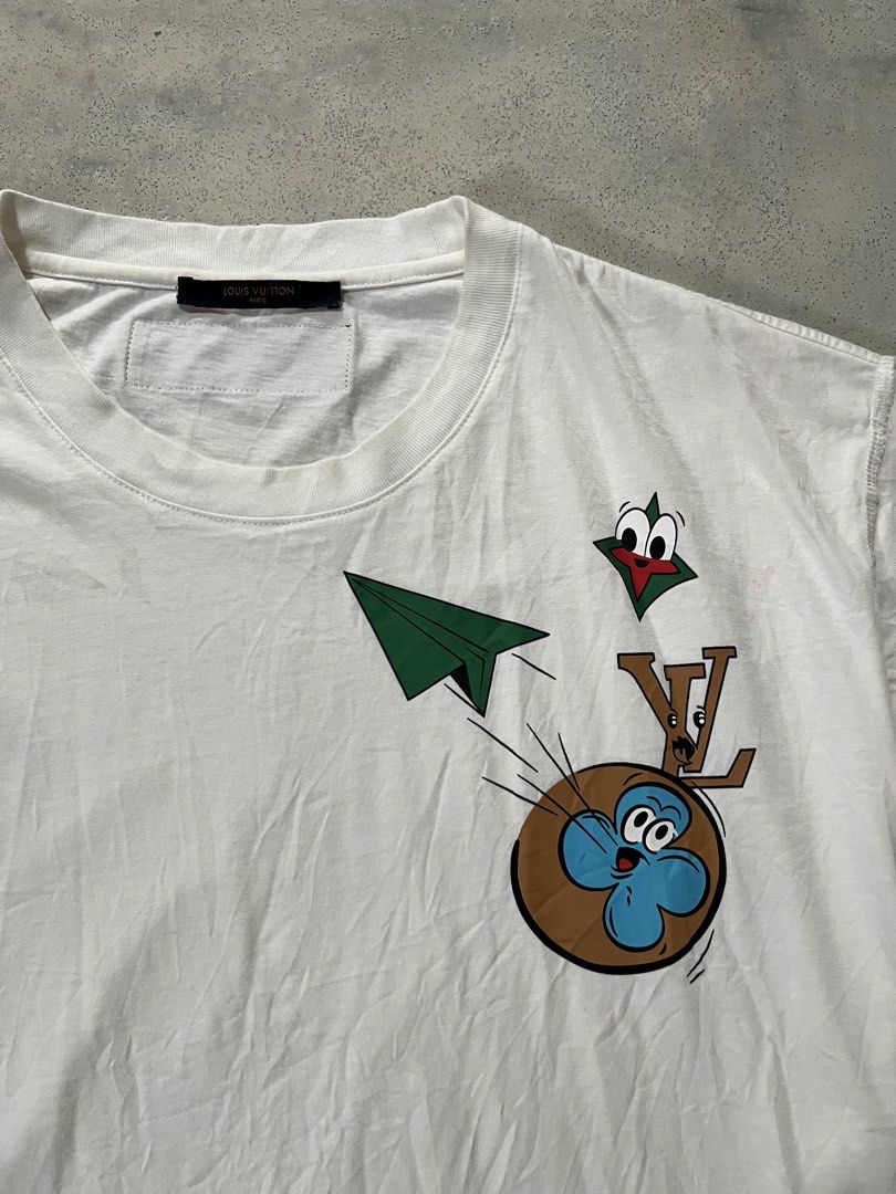 Louis Vuitton White Graphic T-Shirt (Category: Tshirts & Polo Shirts ) located in General Santos City (Dadiangas). Submitted by bornstiborns (Listing ID 1448783460, Image 2). Description: - Authentic Louis Vuitton T-shirt - Color: White - Size: 2XL - Design: Fun graphic print with cartoon characters and LV logo - Origin: Made in Italy - Ideal for: Casual wear.