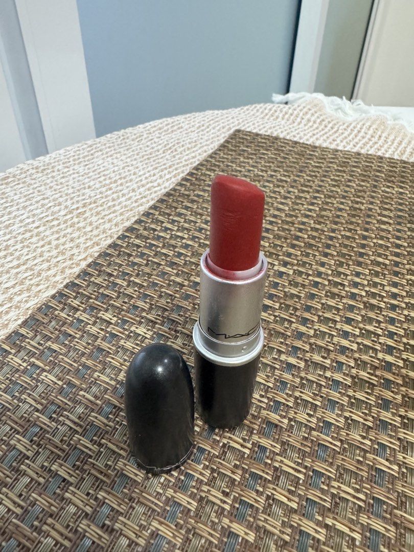 MAC Lipstick - Red Shade (Category: Makeup) located in Mandaluyong City. Submitted by nicxannc (Listing ID 1448820712, Image 1). Description: - Classic Ruby Woo - Partially used, still has plenty of product - Includes original cap - Ideal for achieving a bold, statement lip - A must-have for any makeup collection.