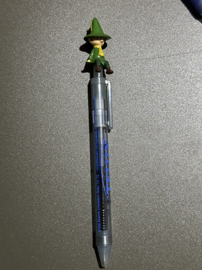 Moomin Characters Pen with Figure Topper (Category: Stationery & School Supplies) located in Manila. Submitted by sharksfin06 (Listing ID 1448799186, Image 1). Description: Pen only; Ink not writing Location: San Miguel, Manila MOP: Gcash MOD: J&T - Adorable Moomin pen featuring a cute character sitting on top. - Smooth writing with blue ink. - Copyright 1990 Moomin Characters. - Ideal for Moomin enthusiasts and collectors of unique stationery. -