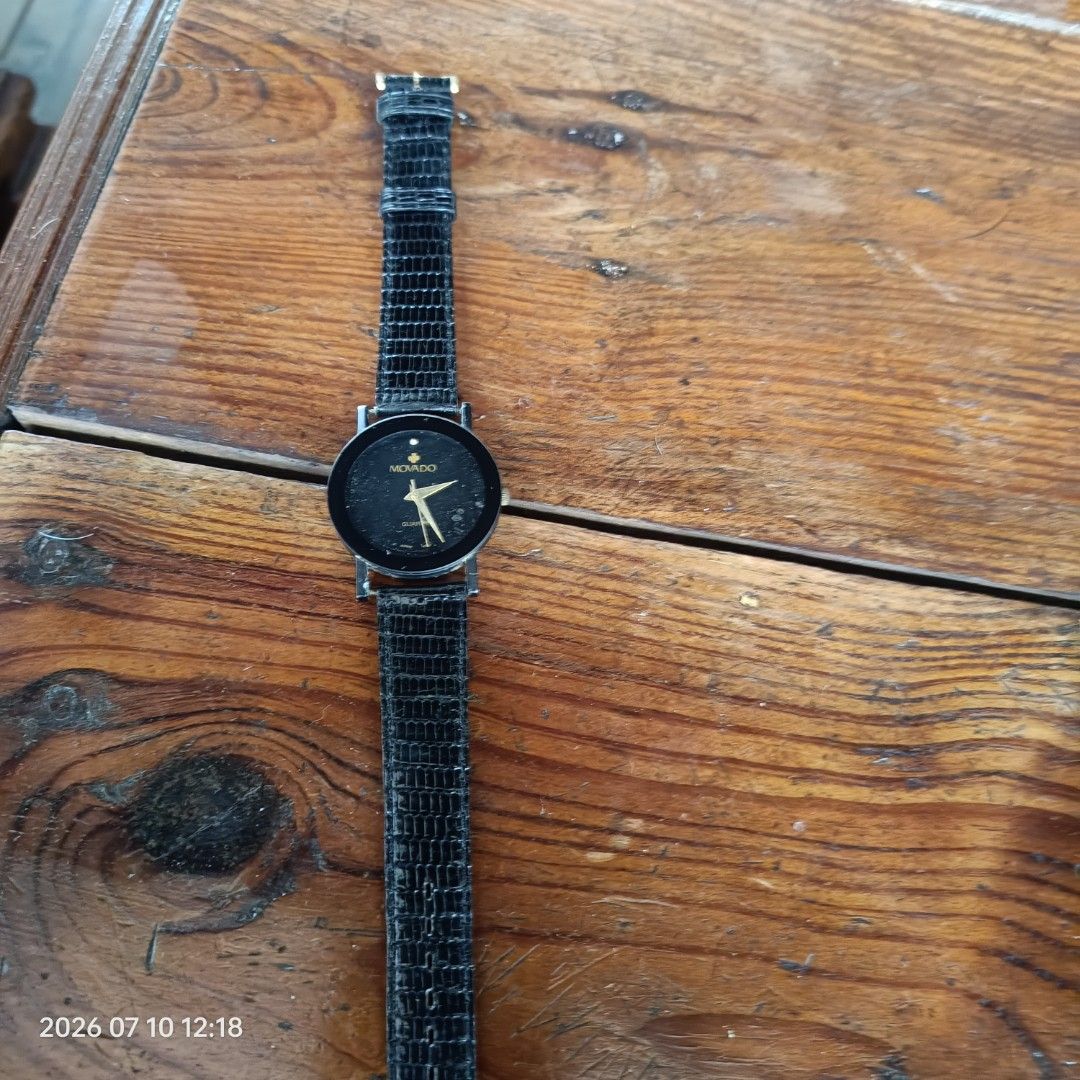 Movado Quartz Watch Black Dial (Category: Luxury Watches) located in Calasiao. Submitted by anthonypeter (Listing ID 1448734793, Image 2). Description: - Movado Watch - Classic Black Dial - Gold-Toned Hands & Markers - Black Textured Strap - Reliable Quartz Movement - Perfect for Everyday Wear.
