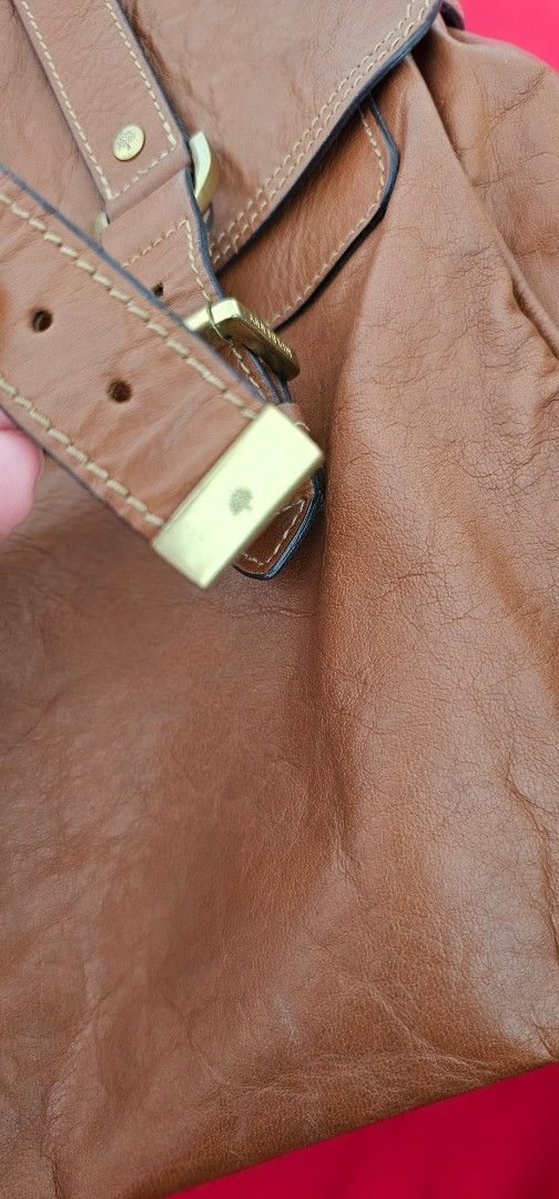 Mulberry Alexa Satchel (Category: Luxury Bags & Wallets) located in Manila. Submitted by ootdmanila2023 (Listing ID 1448719350, Image 3). Description: - Genuine Mulberry brown leather shoulder bag - Iconic postman's lock closure - Unique braided detail on the strap - Interior features a zip pocket and a slip pocket - Comes with original serial number tag - No inclusions, bag only - Can fit a 15-inch laptop - Willing to swap with mulberry bayswate