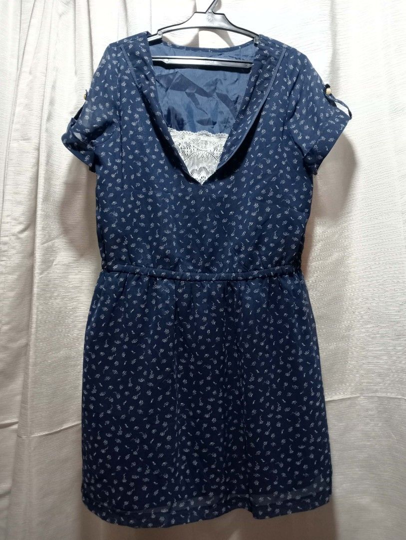 Navy Blue Short Sleeve Dress with White Pattern (Category: Dresses) located in Buhi. Submitted by fpthrift1 (Listing ID 1448699210, Image 1). Description: - Navy blue dress with an all-over white pattern - Short sleeves featuring tie details - Comfortable elasticated waist - Sheer overlay design with an inner lining - Ideal for casual outings and everyday wear.