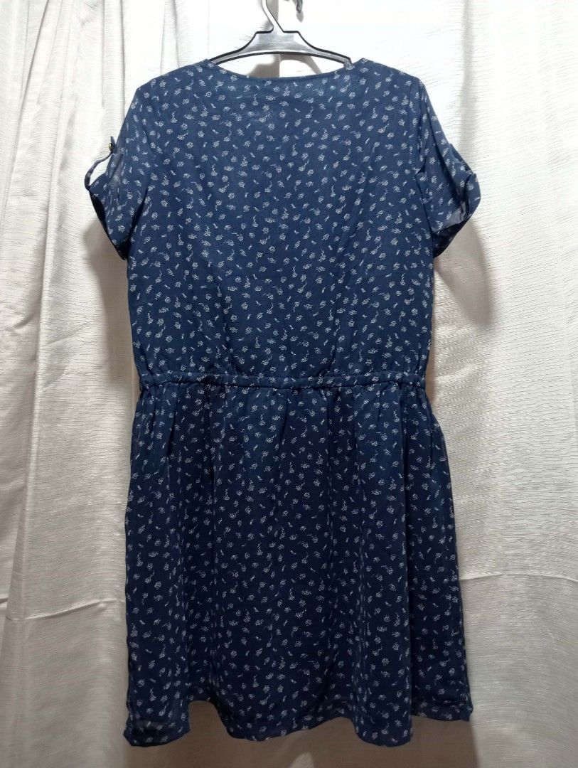 Navy Blue Short Sleeve Dress with White Pattern (Category: Dresses) located in Buhi. Submitted by fpthrift1 (Listing ID 1448699210, Image 2). Description: - Navy blue dress with an all-over white pattern - Short sleeves featuring tie details - Comfortable elasticated waist - Sheer overlay design with an inner lining - Ideal for casual outings and everyday wear.