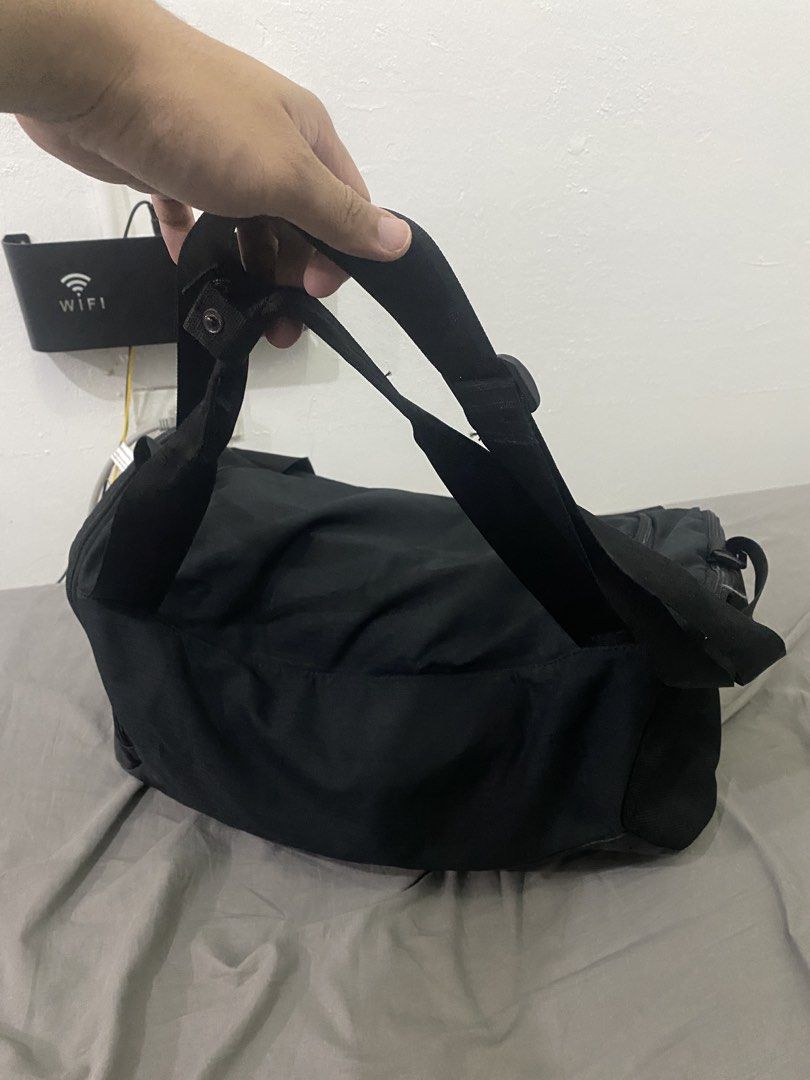 Nike Black Duffel Bag Large Authentic (Category: Sling Bags) located in Makati City. Submitted by hyperdrive_mnl (Listing ID 1448870755, Image 2). Description: - Black Nike duffel bag - Ideal for gym sessions or travel - Spacious main compartment - Convenient side pocket - Adjustable shoulder strap for comfort - Clean interior and exterior - All zippers function smoothly.