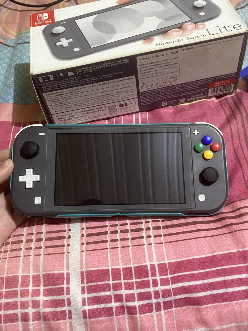 Nintendo Switch Lite Jb 512GB (Category: Nintendo) located in Agdangan. Submitted by marlboro.red (Listing ID 1448869205, Image 2). Description: - Dualboot - W box, extra tempered, extra joystick cover, Cord - Original Sandisk Ultra 512GB - Installed Tempered since day 1 - No issue - Maraming games nasa 51.