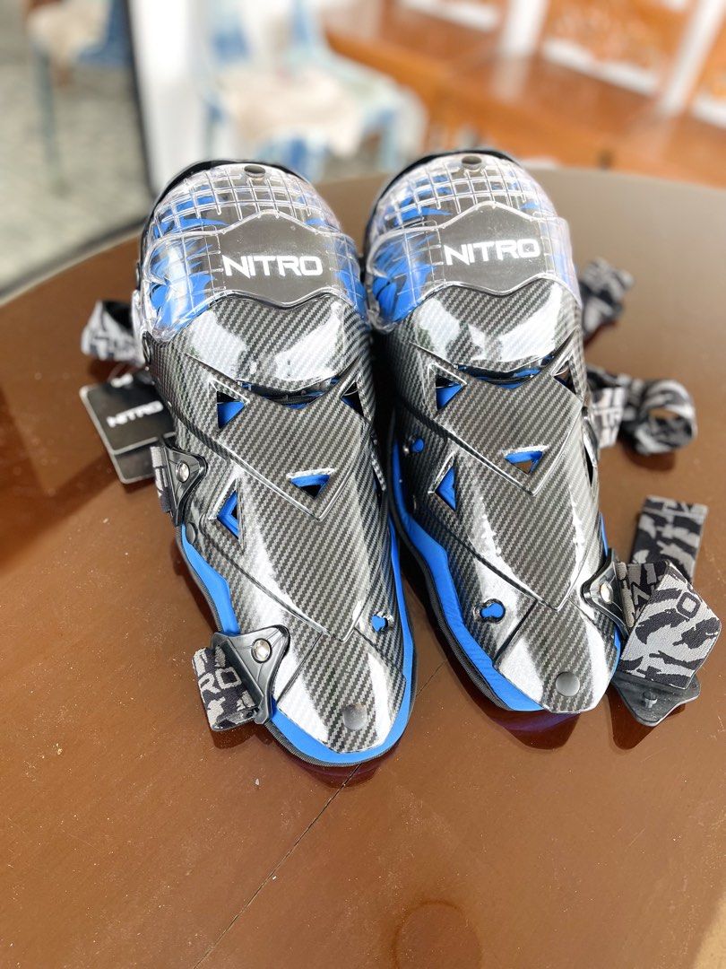 Nitro Motorcycle Knee Guards with Storage Bag (Category: Other Sports Equipment and Supplies) located in Rizal. Submitted by saristuffedmixed (Listing ID 1448696173, Image 2). Description: - Nitro knee guards with stylish carbon fiber look and blue accents. - Adjustable straps ensure a secure and comfortable fit. - Comes with a branded storage bag for easy transport and protection. - Ideal for motorcycle riding, mountain biking, and other action 