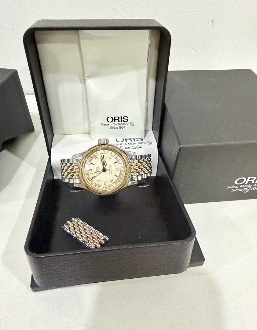Oris Automatic Unisex Watch Complete Set (Category: Luxury Watches) located in Quezon City. Submitted by 18john (Listing ID 1444765021, Image 1). Description: - Oris Unisex Watch with Extra Links included - comes with its Oris box and paperwork - Two-tone metal bracelet steel and Rose-gold tone - Pointer Date hand - Made in Switzerland - normal signs of usage as this is a used item.