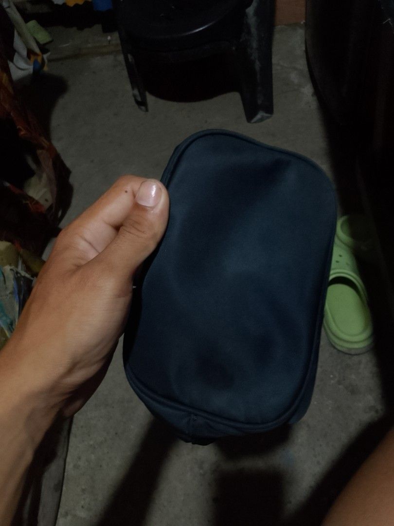Prada Black Nylon Drawstring Bag with Pouch (Category: Luxury Bags & Wallets) located in Iloilo. Submitted by janillthrifted (Listing ID 1448796941, Image 3). Description: - Authentic Prada Bag - Color: Black - Material: Nylon - Features: Front zippered pocket, drawstring closure - Hardware: Gold details - Includes: Separate small pouch - Ideal for: Everyday use.