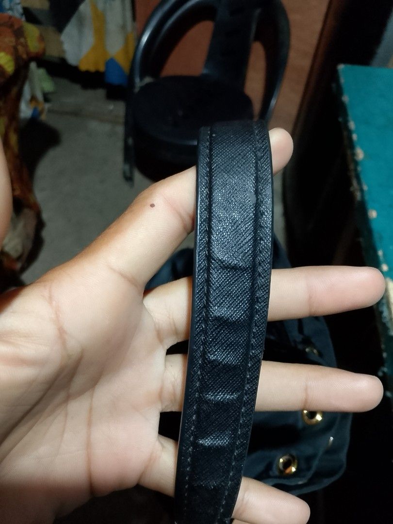 Prada Black Nylon Drawstring Bag with Pouch (Category: Luxury Bags & Wallets) located in Iloilo. Submitted by janillthrifted (Listing ID 1448796941, Image 2). Description: - Authentic Prada Bag - Color: Black - Material: Nylon - Features: Front zippered pocket, drawstring closure - Hardware: Gold details - Includes: Separate small pouch - Ideal for: Everyday use.