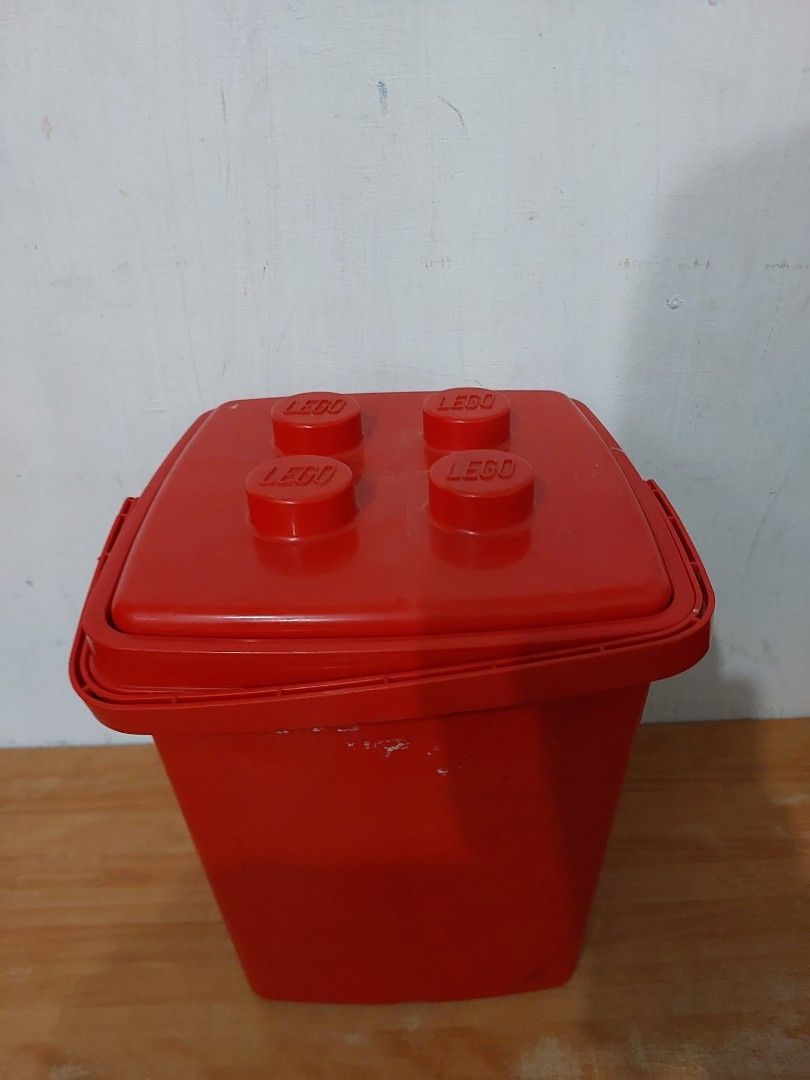 Red Lego Storage Box with Lego Bricks Inside (Category: Storage Boxes & Baskets) located in Quezon City. Submitted by jpnvintageonline (Listing ID 1448806226, Image 3). Description: - Red storage box shaped like a classic Lego brick. - Features a convenient handle for easy carrying. - Secure lid with four iconic Lego studs. - Comes pre-filled with a variety of Lego bricks (different colors and sizes). - Ideal for organizing and storing your Lego 