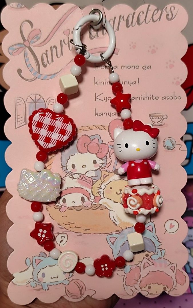 Sanrio Characters Kuromi & Hello Kitty Beaded Keychain Charm (Category: Character Goods) located in Makati City. Submitted by audreygatchalian (Listing ID 1448816974, Image 3). Description: - Adorable Sanrio keychain charms featuring Kuromi, Kitty, My Melody and kerropi - Decorated with vibrant, colorful beads. - Handmade with attention to detail. - Ideal for personalizing bags, backpacks, or keys. - A fantastic accessory for any Sanrio enthusias