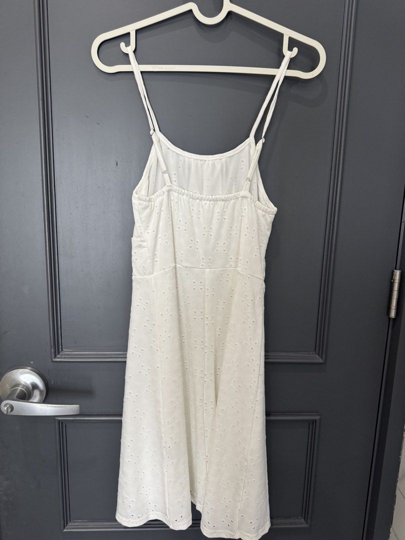 SHEIN White Eyelet Spaghetti Strap Mini Dress (Category: Dresses) located in Manila. Submitted by pinkyclothes1267 (Listing ID 1448722506, Image 2). Description: - White eyelet mini dress from SHEIN - Spaghetti straps - Gathered bust detail - Elasticated waistband for comfort - All-over eyelet pattern on fabric - Eyelet detailing on hemline - Ideal for casual outings or beach days.