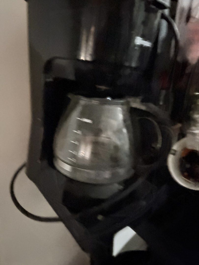 Simplus Black Drip Coffee Maker with Glass Carafe (Category: Coffee Machines & Makers) located in Taguig. Submitted by bendthetrends20 (Listing ID 1448707534, Image 2). Description: - Brand: Simplus - Type: Drip Coffee Maker - Capacity: 6-8 cups - Carafe: Glass - Condition: Used, shows dust and minor scuffs from storage, but fully functional. - Features: Visible power cord - Ideal for: Daily morning coffee.