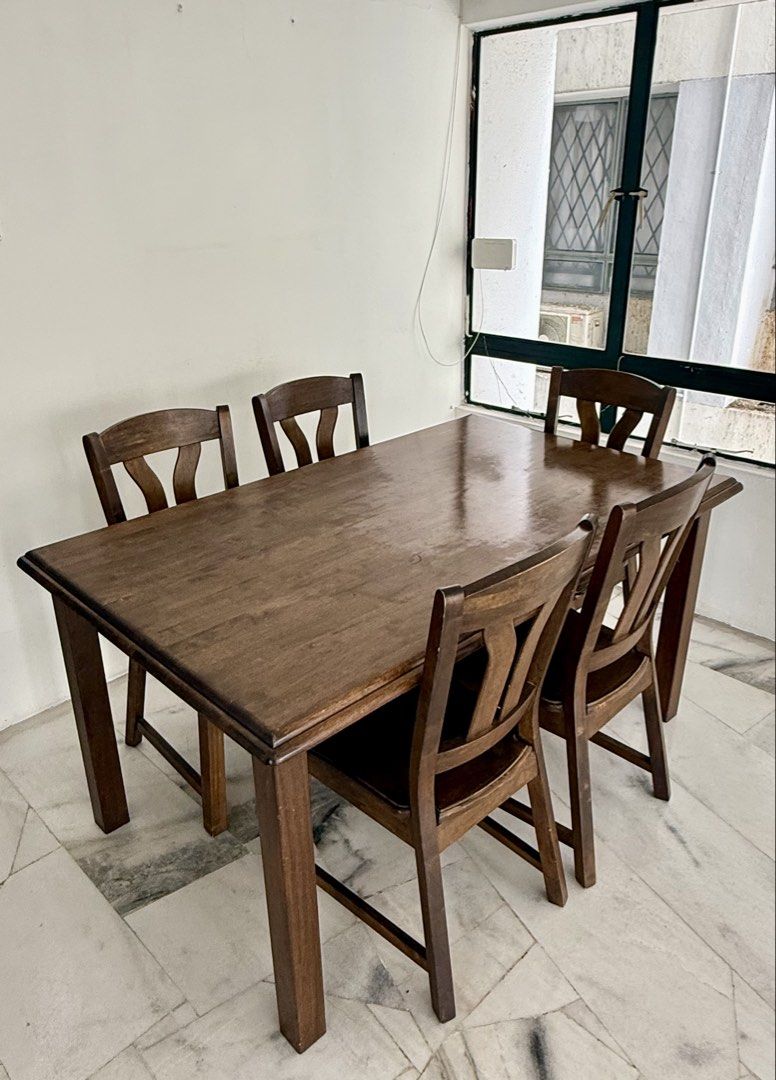 Solid Wood Dining Table Set (Category: Tables & Sets) located in Kuala Lumpur. Submitted by nurdynh12 (Listing ID 1448840374, Image 1). Description: Material: Solid Wood Seats: 5 Colour: Dark Brown - Includes 1 dining table and 5 matching chairs. - Strong and sturdy construction - Suitable for dining room, apartment, or home use - Normal signs of use but overall well maintained. - Selling as a complete set. - Self-pickup preferred. Feel free to m