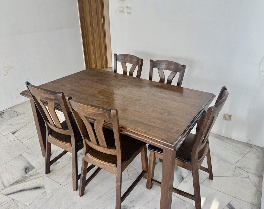 Solid Wood Dining Table Set (Category: Tables & Sets) located in Kuala Lumpur. Submitted by nurdynh12 (Listing ID 1448840374, Image 3). Description: Material: Solid Wood Seats: 5 Colour: Dark Brown - Includes 1 dining table and 5 matching chairs. - Strong and sturdy construction - Suitable for dining room, apartment, or home use - Normal signs of use but overall well maintained. - Selling as a complete set. - Self-pickup preferred. Feel free to m