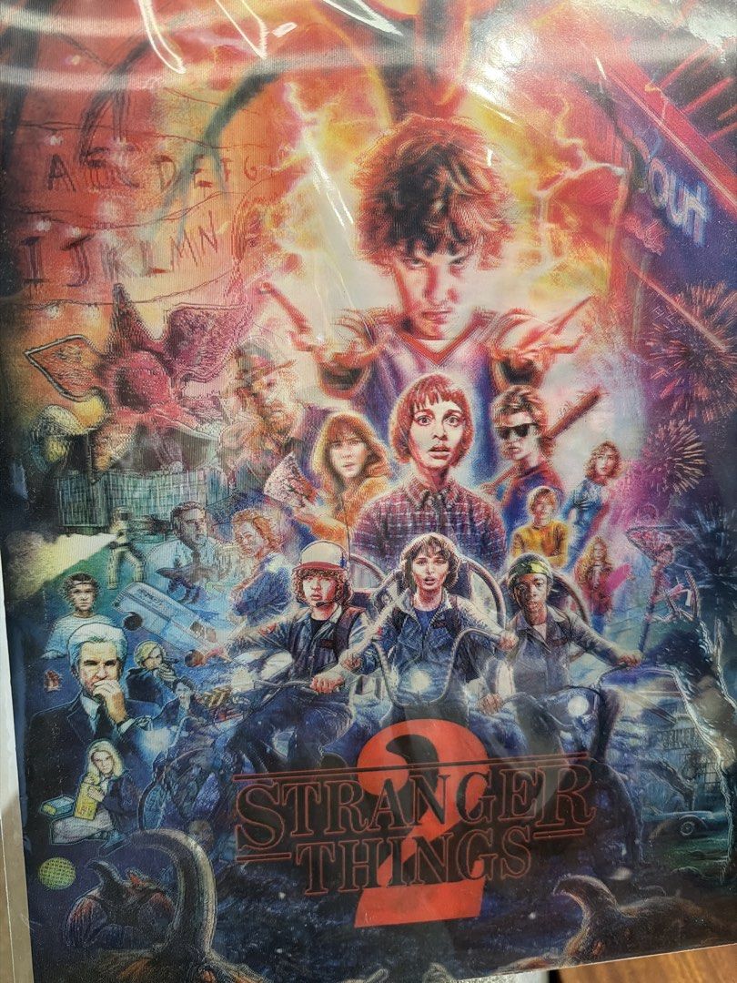 Stranger Things 2 Lenticular Poster (Category: Western Merchandise) located in Las Pinas. Submitted by oliveguns (Listing ID 1448893812, Image 2). Description: - Stranger Things 2 - Lenticular Poster - Features main cast and iconic show imagery - Perfect for fan collections - Size: Approximately 12x15 inches - Material: Glossy lenticular board.