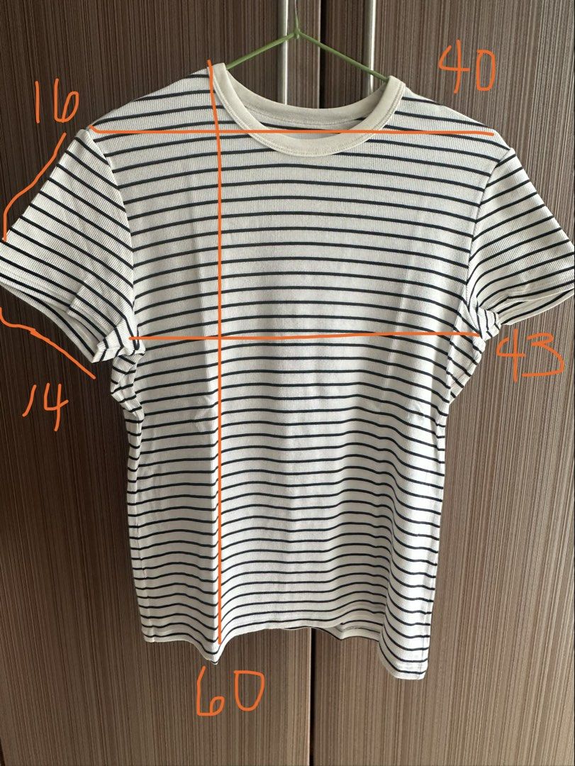 Striped T-shirt (Category: Shirts) located in Taguig. Submitted by stigmapanda (Listing ID 1448843688, Image 3). Description: - Classic white t-shirt with black horizontal stripes - Crew neck, short sleeves - Measurements: Length 60cm, Chest 43cm, Sleeve length 16cm, Shoulder width 14cm - Comfortable and versatile for everyday wear.