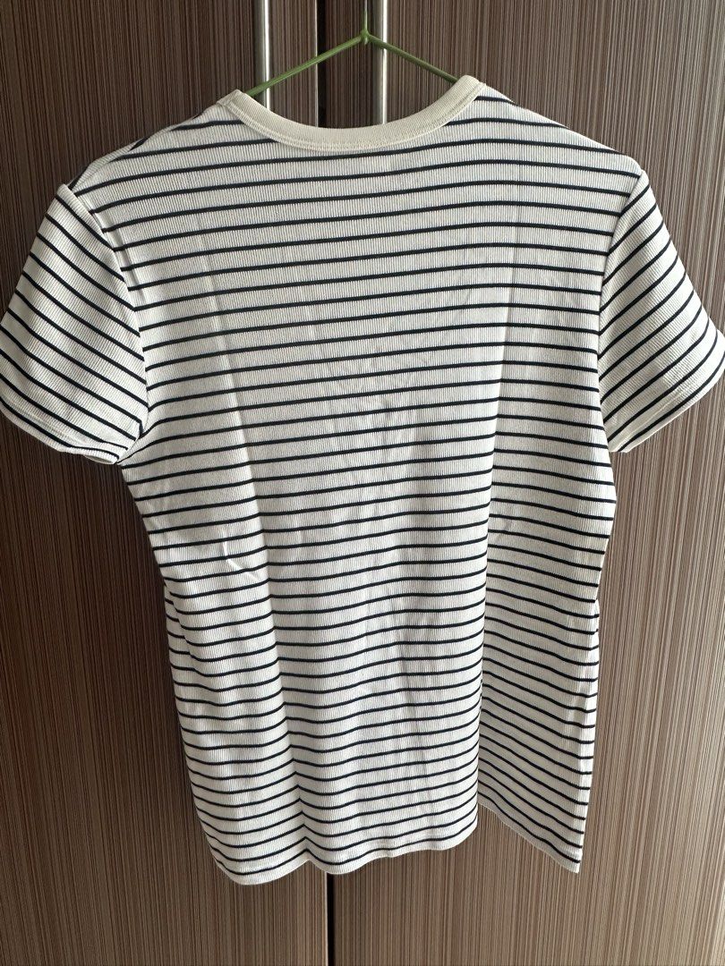 Striped T-shirt (Category: Shirts) located in Taguig. Submitted by stigmapanda (Listing ID 1448843688, Image 2). Description: - Classic white t-shirt with black horizontal stripes - Crew neck, short sleeves - Measurements: Length 60cm, Chest 43cm, Sleeve length 16cm, Shoulder width 14cm - Comfortable and versatile for everyday wear.