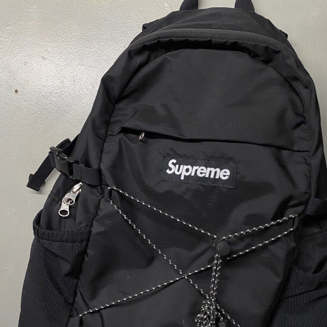 Supreme Black Cordura Fabric Backpack (Category: Backpacks) located in Cagayan de Oro. Submitted by sumamestreethub (Listing ID 1448746911, Image 2). Description: - Black Supreme backpack - Made with durable Cordura fabric - Adjustable straps - Multiple pockets for organization - Spacious interior - Ideal for everyday use or travel - Shows minimal signs of wear.