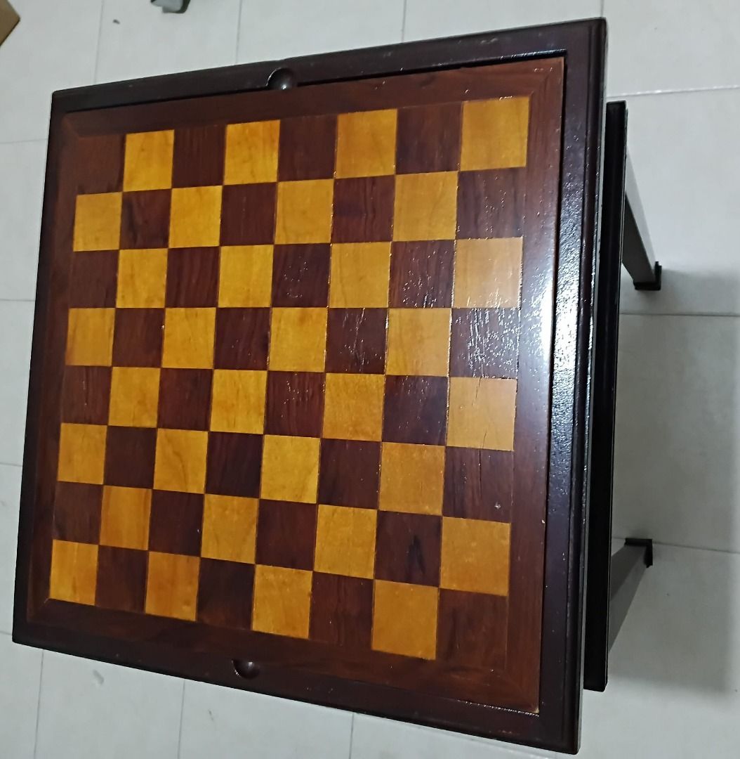 Table: Chess (Category: Board Games & Puzzles) located in Singapore. Submitted by dakes69 (Listing ID 1448747352, Image 4). Description: - Newly Refurbished ChessBoard - Wooden game table - Chessboard - Includes game pieces for: Chess. - Ideal for hosting fun game nights.
