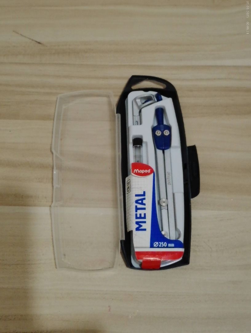 TAKE ALL! Deli Triangle Set Ruler & Maped Compass (Category: Stationery & School Supplies) located in Manila. Submitted by declutter.rizz (Listing ID 1448822380, Image 3). Description: - Set includes clear triangle rulers (one set) and one 45° triangle ruler. - Maped Compass comes with a metal compass in a protective case. - Ideal for technical drawing, drafting, and school projects. - All items are in good, usable condition. - Items are negotiab