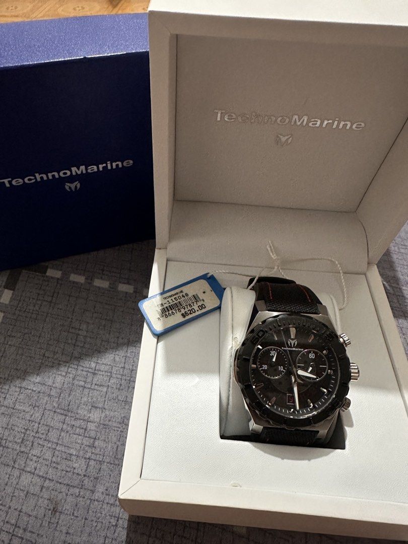 TechnoMarine Chronograph Watch TH-11504B (Category: Men's Watches) located in Angono. Submitted by kiba_inuzuka (Listing ID 1448768309, Image 2). Description: - Authentic TechnoMarine Chronograph Watch - Sleek Black Dial with Silver Accents - Durable Black Strap with Stylish Red Stitching - Comes with Original Box and Tag - Original Retail Price: $620.00 - Versatile: Ideal for Everyday Wear or Special Occasions.