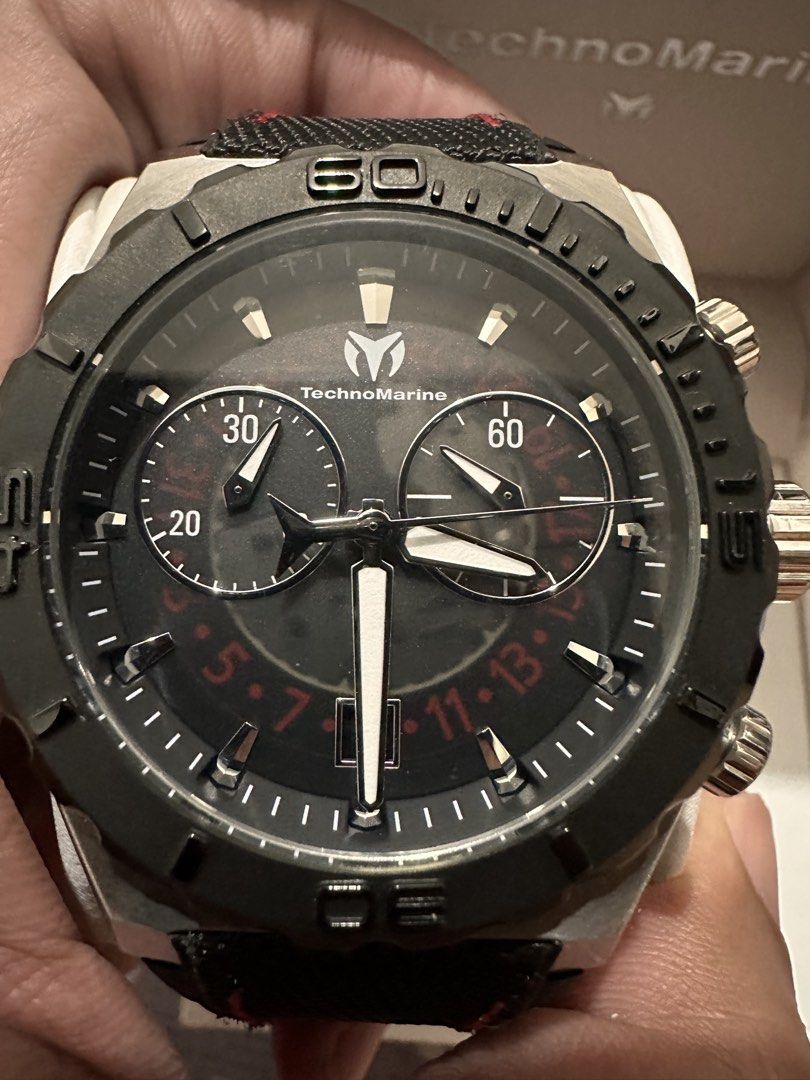 TechnoMarine Chronograph Watch TH-11504B (Category: Men's Watches) located in Angono. Submitted by kiba_inuzuka (Listing ID 1448768309, Image 3). Description: - Authentic TechnoMarine Chronograph Watch - Sleek Black Dial with Silver Accents - Durable Black Strap with Stylish Red Stitching - Comes with Original Box and Tag - Original Retail Price: $620.00 - Versatile: Ideal for Everyday Wear or Special Occasions.