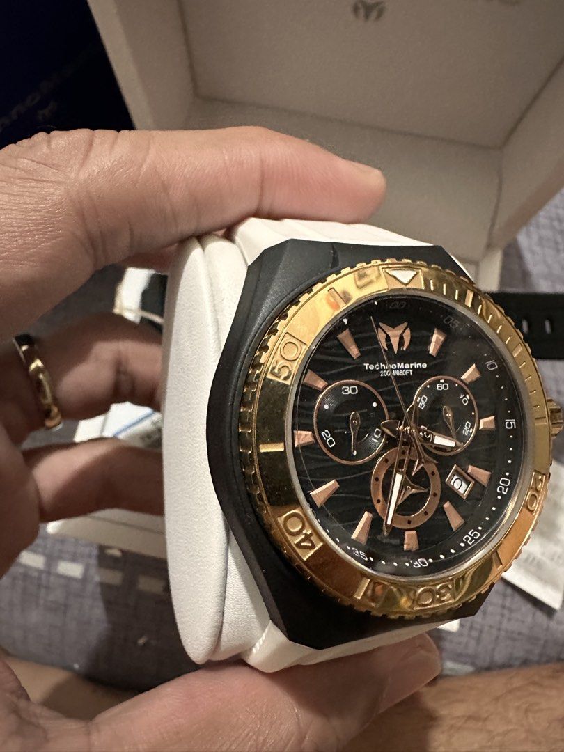 TechnoMarine Chronograph Watch Rose Gold Black White (Category: Women's Watches) located in Angono. Submitted by kiba_inuzuka (Listing ID 1448768524, Image 3). Description: - TechnoMarine Chronograph Watch - Rose gold accents on black dial - Black bezel - White strap (plus extra black strap included) - Original box included - Original price tag: $525.00 - Ideal for diving and everyday wear.