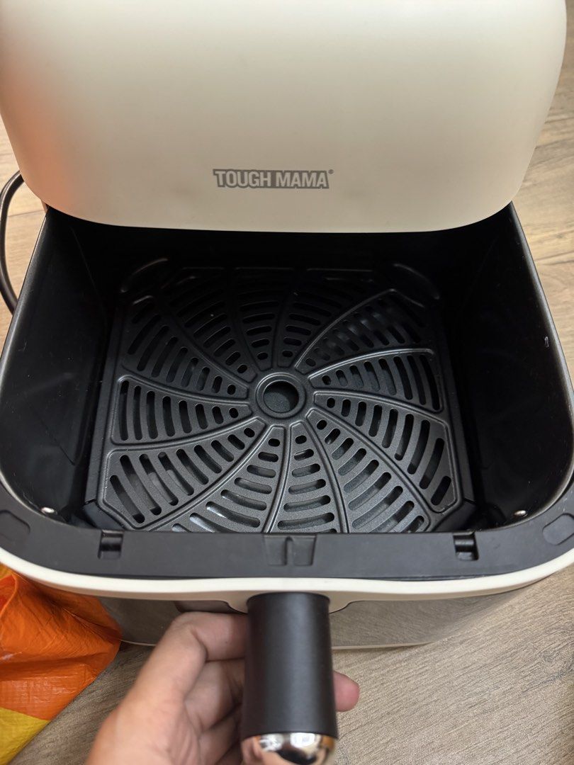 Tough Mama Air Fryer (Category: Fryers) located in Taguig. Submitted by byebyebabies (Listing ID 1448781807, Image 2). Description: - White Tough Mama Air Fryer - Dual knobs for temperature and timer control - Easy-slide-out basket - Clean interior - Ideal for quick meals and snacks - Simple to operate.
