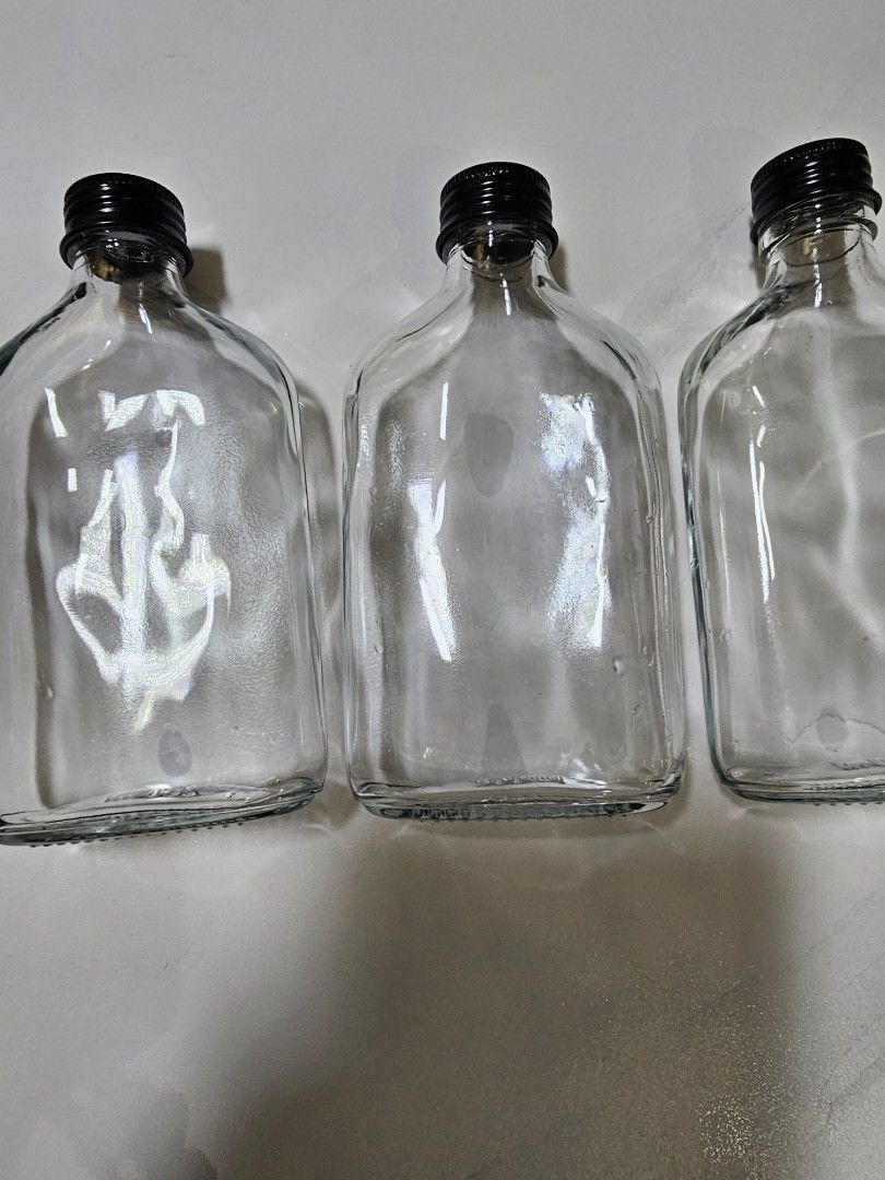 Transparent glass bottle or vase
