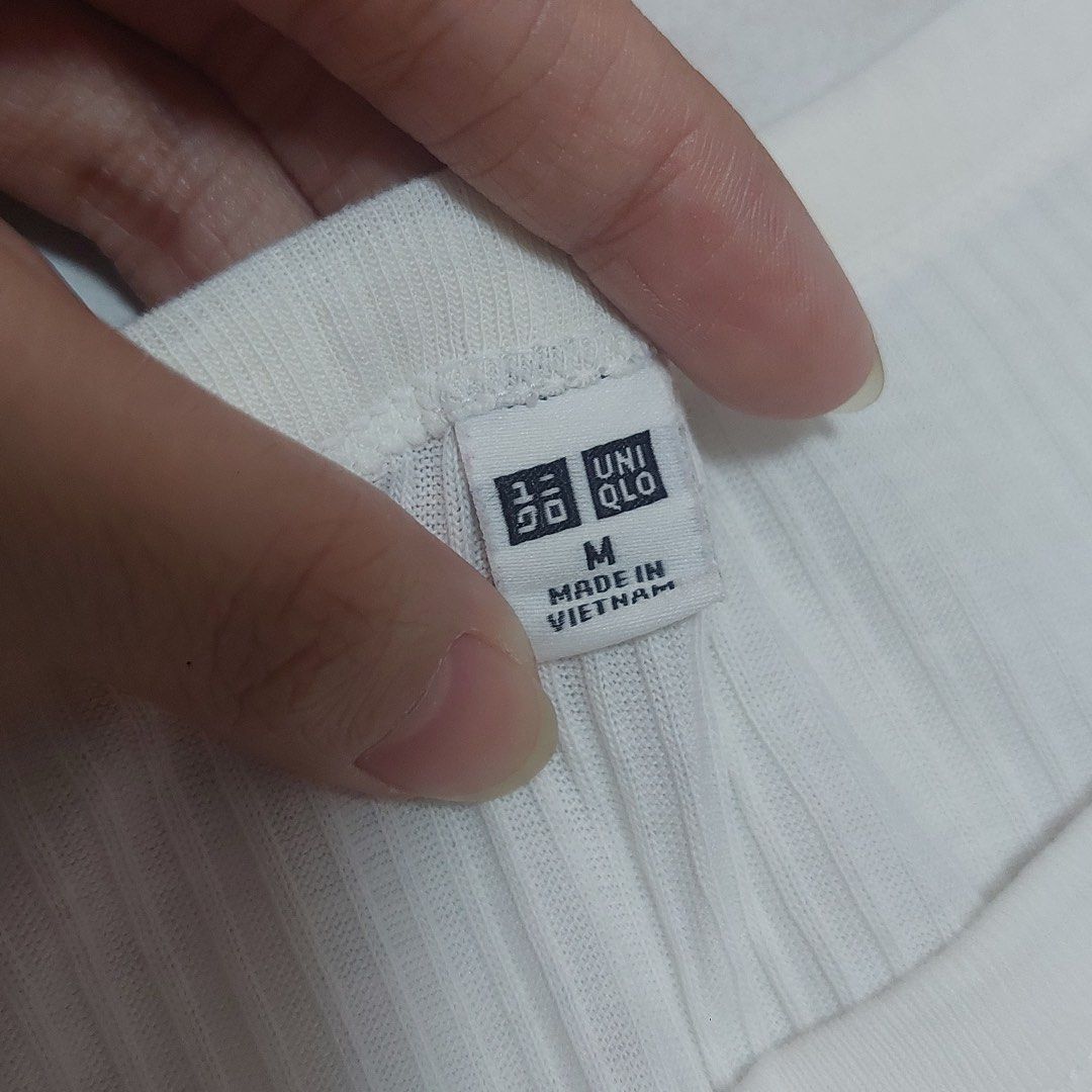 Uniqlo White Ribbed T-shirt - Size Medium (Category: Shirts) located in Quezon City. Submitted by _ysxh (Listing ID 1448759030, Image 2). Description: - Uniqlo White Ribbed T-shirt - Size: Medium - Measurements: Width 43 cm, Length 61.5 cm - Condition: Well used with minimal stains - Perfect as a versatile basic piece RFS: Decluttering - Shipping to be shouldered by buyer (Item is located in Quezon City) - Mode of Payment: Online transfer to BDO 