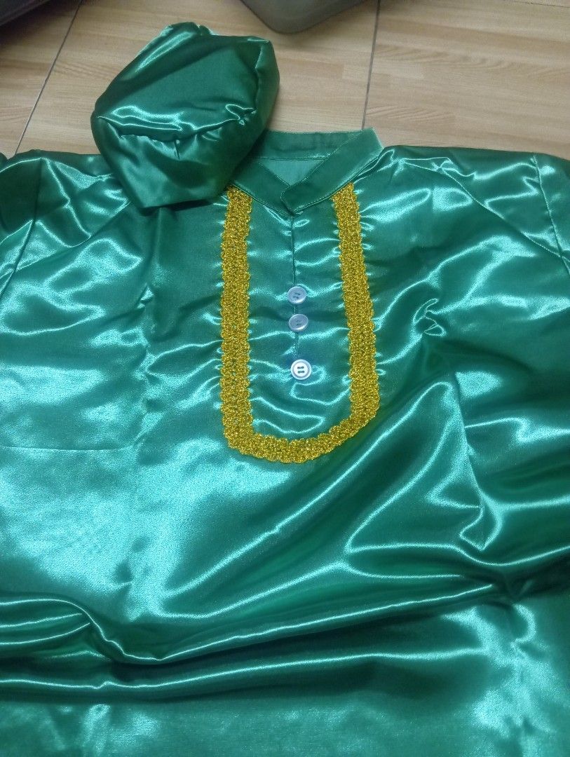 United Nation costume Indian (Category: Sets & Coordinates) located in Quezon City. Submitted by jianne07 (Listing ID 1448782570, Image 2). Description: - Shiny green satin fabric - Matching cap included - Elegant gold trim on collar and chest - Three front buttons - Comfortable elastic waistband on pants - Ideal for cultural events and performances.