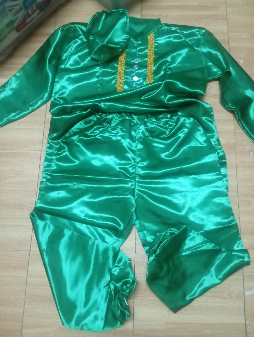 United Nation costume Indian (Category: Sets & Coordinates) located in Quezon City. Submitted by jianne07 (Listing ID 1448782570, Image 1). Description: - Shiny green satin fabric - Matching cap included - Elegant gold trim on collar and chest - Three front buttons - Comfortable elastic waistband on pants - Ideal for cultural events and performances.