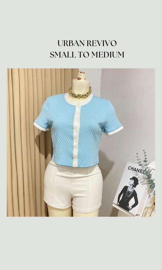 URBAN REVIVO Blue Cropped Button-Up Top (Category: Blouses) located in San Fernando. Submitted by oopssallcloset (Listing ID 1448718332, Image 1). Description: - Brand: Urban Revivo - Style: Blue cropped top - Features: Short sleeves with white trim, white buttons down the front, textured fabric - Fit: Small to Medium.