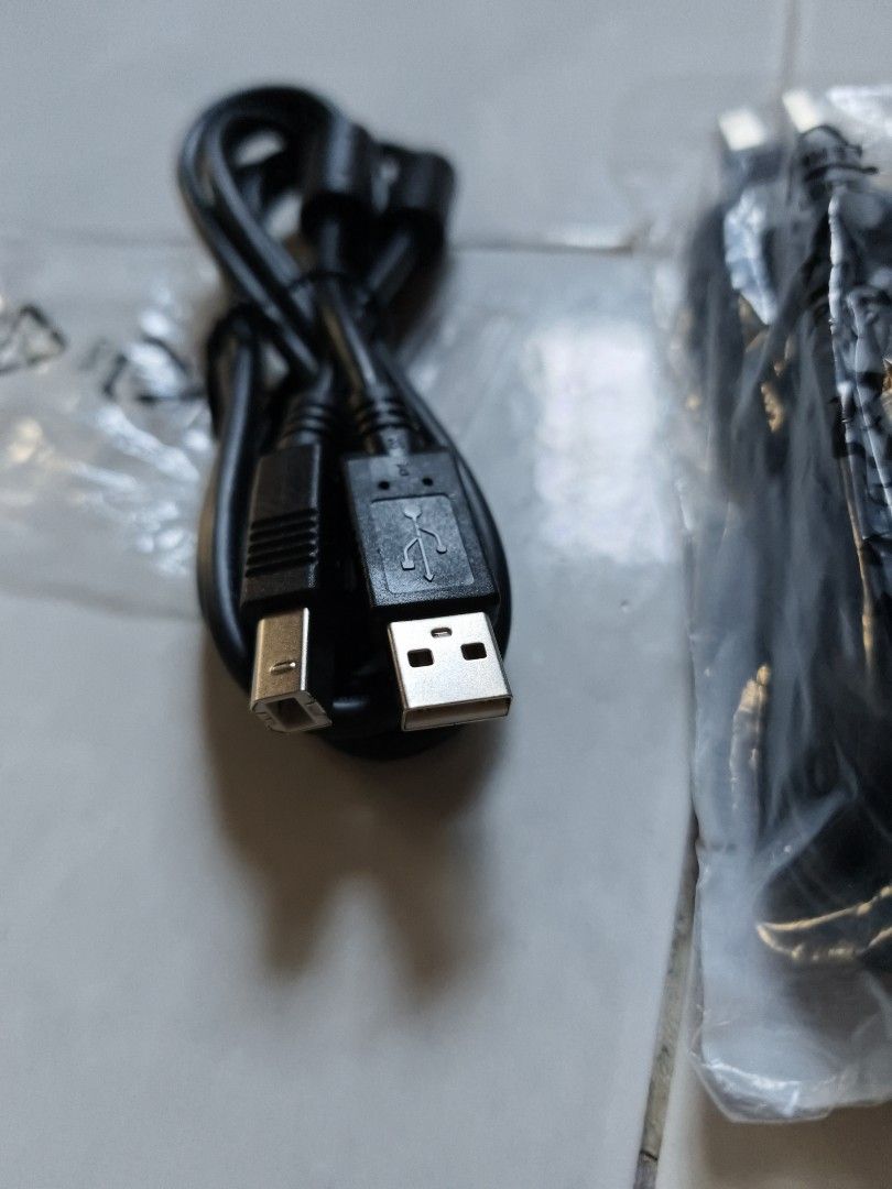 USB Printer Cable (Category: Cables & Adaptors) located in Singapore. Submitted by jumpjeffjump (Listing ID 1448797608, Image 2). Description: - USB A to B cables - Standard printer cable type - Color: Black - Individually packaged - Ideal for printers, scanners, and other USB B devices - Excellent value bundle .